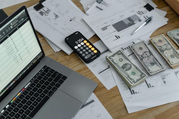 Banknotes and calculator on a table